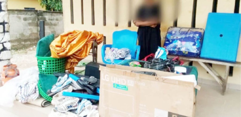 The Suspect With Some Of The Items Recovered From Her