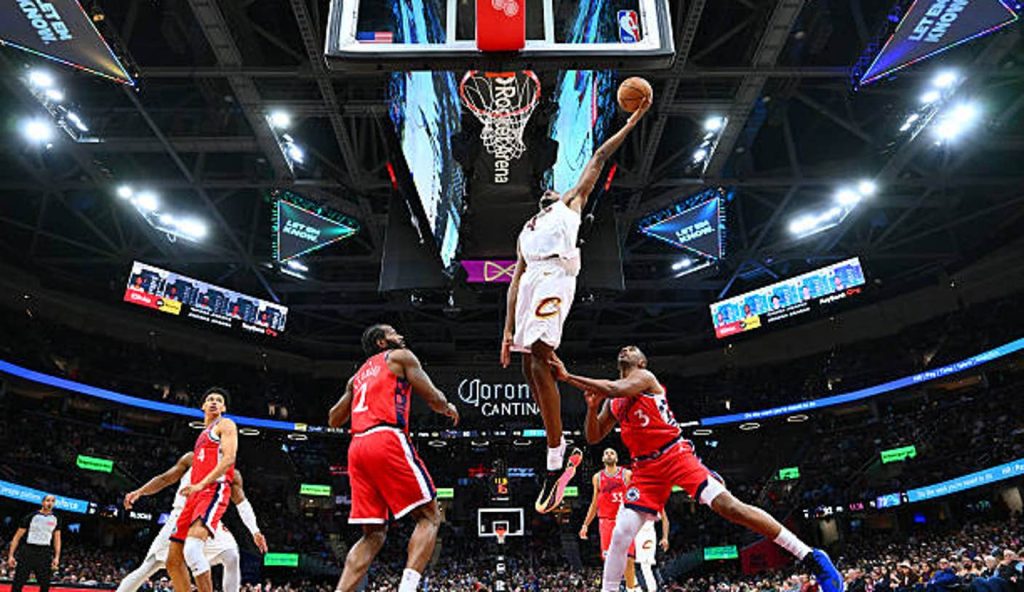 Cleveland Ohio Center Evan Mobley Of The Cleveland Cavaliers Shoots Over Guard Chris Paul Of Cleveland Ohio Center Evan Mobley Of The Cleveland Cavaliers Shoots Over Guard Chris Paul Of