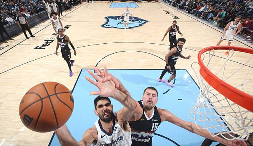 Memphis Tn Santi Aldama Of The Memphis Grizzlies Drives To The Basket As Nikola Jokic Of The