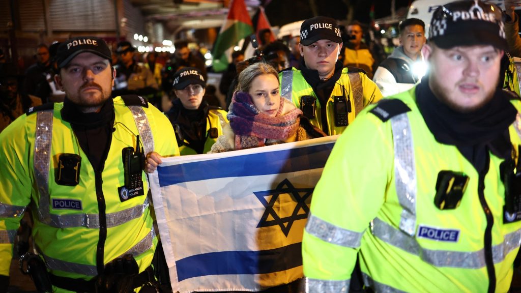 Police Officers Escort Woman Israeli 1036621206 Why Israeli Teams Compete In Uefa Competitions Despite Being In Asia?