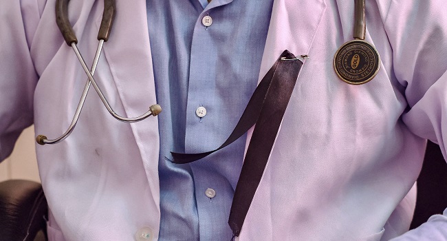 A Doctor Is Pictured Wearing A Black Ribbon Indiawomendoctorsstrikehospital A Doctor Is Pictured Wearing A Black Ribbon Indiawomendoctorsstrikehospital