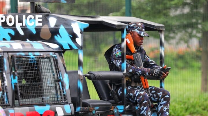 Nigeria Police On His Mobile Phone E1661776070240 Nigeria Police On His Mobile Phone E1661776070240