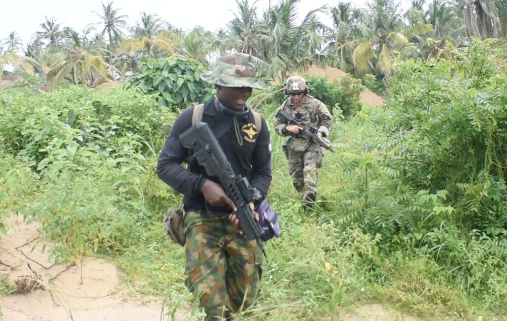 An Officer Of The Nigerian Navy Special Boat Service Left During The Five Week Joint Combined Exchange Training Jcet Alongside A Team Of U.s. Army Special Forces An Officer Of The Nigerian Navy Special Boat Service Left During The Five Week Joint Combined Exchange Training Jcet Alongside A Team Of U.s. Army Special Forces