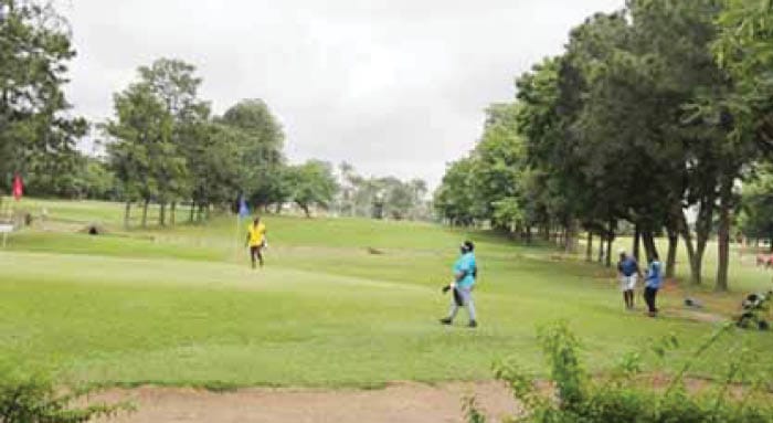 Golfers In Action On The Lush Greens Of Ikoyi Clubs Golf Course Golfers In Action On The Lush Greens Of Ikoyi Clubs Golf Course