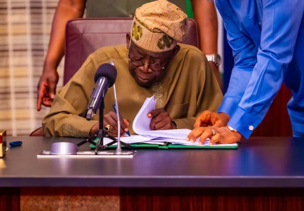 Tinubu Signs Tinubu Signs